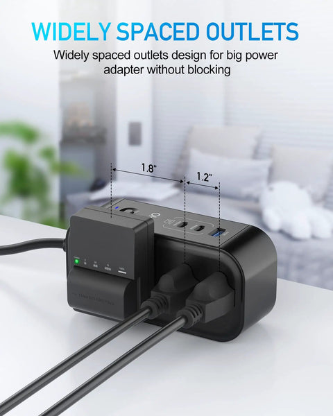 On-The-Go 9-In-1 PD 65W USB-C Power Strip With 6 AC Outlets, widely spaced for large adapters, on a desk