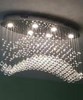 Modern Oval K9 Crystal Chandelier With 6 Light Raindrop Design, Chrome Finish Flush Mount Pendant Light for dining room.