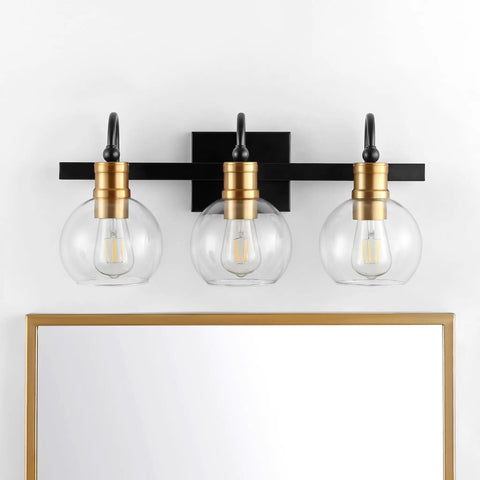 21.5 Inch Black And Brass Gold Vintage Wall Sconce With Clear Glass Globe Shade above a mirror