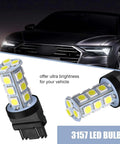Lit 10 Pack 3156 3157 LED Tail Lights With 18 SMD Chips 6500K White DC12V bulbs next to a car