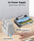 All In One 65W Fast Charge Drone Charging Hub with DJI Flip drone batteries and controller setup, 27000mAh 100Wh power bank.