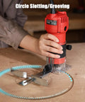 Using Beefy 630W Wood Router Tool With Fixed Base for circle slotting on wooden surface, showing compact design in action.