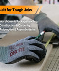 Person wearing Nitrile Work Gloves FN330 With All Day Comfort And 3D Stretch Fit, holding a pencil for precise grip and dexterity