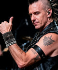 Dope Eight Piece Punk Rock Studded Leather Bracelet Set With Adjustable Spiked Zinc Cuffs worn by a musician in concert.