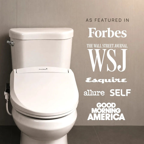 Slick Smart Bidet Toilet Seat With Heated Seat And Warm Water Spray Plus Air Dryer Remote Control Elongated Shape, featuring a white design in a modern bathroom.