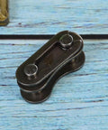 Heavy Hitter Stainless Steel Chain Master Links For Bikes And Cycles No Sweat Connector Repair Parts close-up view on wooden background.