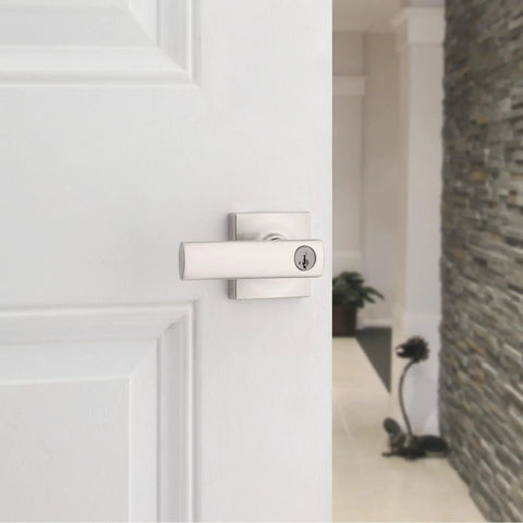 Breton Entry Door Handle With Lock And Key, Reversible Exterior Lever for front doors, satin nickel, on white door