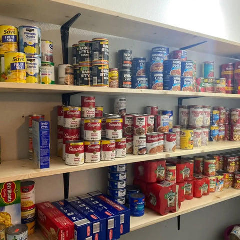 Pantry shelves supported by Beefy Heavy Duty Black Metal Shelf Brackets Set Of 20 6 Inch By 5 Inch holding canned goods