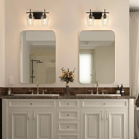 Bathroom with 2 Light Vanity Light Fixture With Clear Glass Shades And Matte Black Finish over two mirrors, E26 Socket Compatible