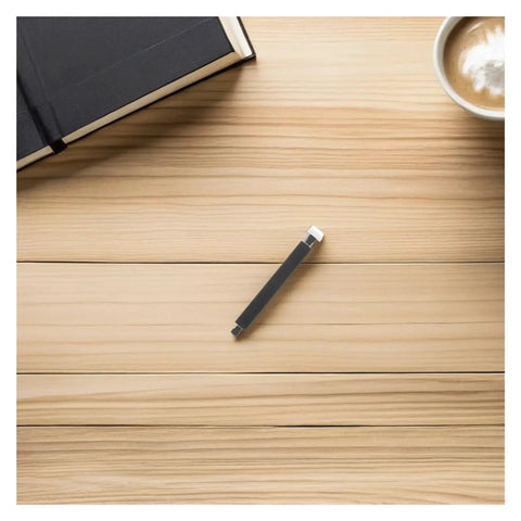 Plastic Bearing Roller Pinch Feed Shaft For Barcode Label Printer Replacement Part on a wooden table next to a notebook and coffee.