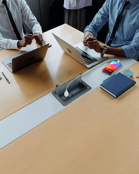 Conference table with Table Power Multimedia Connectivity Box For Conference Rooms With 2 Outlets, RJ45 Ethernet, USB 3.0, HDMI, VGA, and 3.5mm Audio, Easy Install In Black Brushed Metal With Slow Close Lid, Upgraded USB 3.0 For Faster Data Transfer visible with open slow-close lid