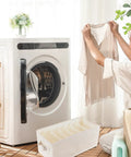 Multi Grid Linen Cotton Closet Organizer Drawer Box With Durable Fabric Dividers used for sorting clothes near a washing machine.