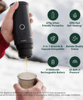 Person holding Nano Portable Espresso Maker For Travel And Camping Self Heating With USB C Car Coffee Maker beside cup