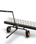 60 Inch Tow Behind Landscape Rake For ATVs And Mowers, beefy steel teeth, shown from side view with universal pin hook attachment.