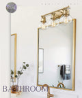 Gold Finish Sleek Modern Vanity Light Fixture With Three Clear Glass Globes Over Mirror For Bathroom Renovation Brighten Your Sink Area Easy Installation Stylish And Durable Bath Lighting