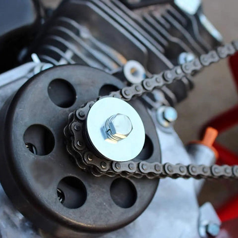 Close-up of Beefed Up Kart Sprocket Kit Three Quarter Inch Bore Twelve Tooth Heavy Duty Steel with Tool for Thirty Five Chain fitting engine.