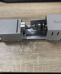Bachin mini wood lathe side view; silver benchtop lathe with chuck and sliding carriage.