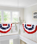 Patriotic Outdoor Pleated Fan Flags 1.5x3 Feet Stars And Stripes Banner 4 Pack displayed on a bright porch railing indoors