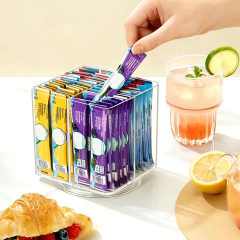 No Sweat Spin Lazy Susan Drink Packet Organizer Square Four Compartment Pantry Turntable holding flavor drink packets on countertop.