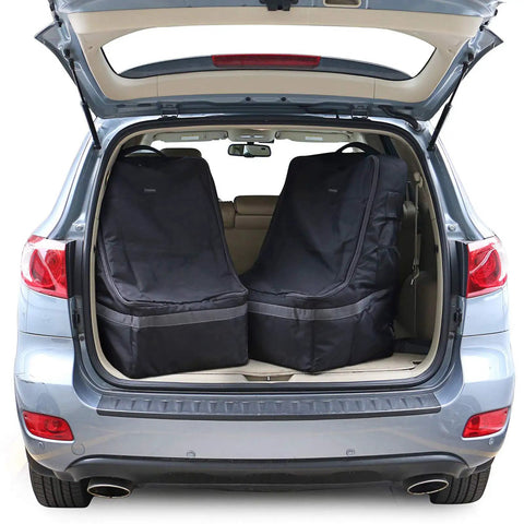 Open car trunk with two black Padded Car Seat Travel Bag For Airplane Travel With Shoulder Strap Heavy Duty Carrier Fits Most Major Brands