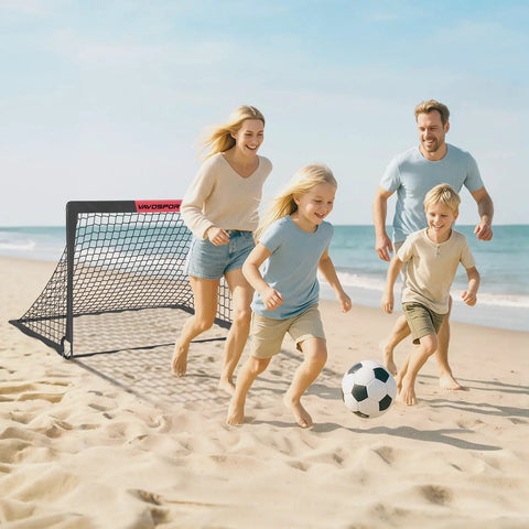 Family playing soccer on the beach with Two 4x3 Ft Portable Pop Up Soccer Goals Backyard Training Set With Ball Pump Cones Ground Nails And Carry Bag