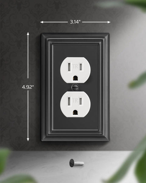 Set Of Four Black Metal Outlet Covers For Outlets Measuring 4.88 By 3.13 Inches Durable Wall Plates For Kitchen And Home Upgrade Your Space With A Sleek Modern Industrial Look And Easy Install, shown installed on wall with dimensions.