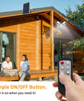 Beast Mode Bright Solar Pendant Light With Remote And Large Solar Panel 228 LEDs illuminating wooden porch