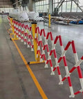 Hardened Steel Expanding Safety Barricade Hella Visible Traffic Barrier With Slick Rolling Casters Top Shelf Folding Pedestrian Gate For Driveways And Worksites Solid Red White Color Block Design in a warehouse setting.
