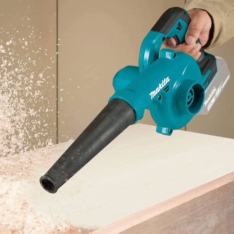 Heavy Hitter 18V Cordless Leaf Blower Featuring Variable Three Speed Control and 219 Mph Air Velocity blowing wood shavings off a surface.