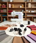 6 Piece Black Universal Zipper Repair Kit With Quick Fix Sliders For No Tool Needed Replacement, displayed on table