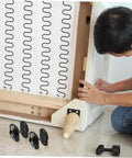 Person installing Dead Simple Sectional Sofa Connectors Pin Style Furniture Buckles on a couch frame.