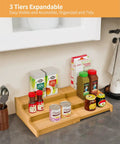 Premium Grade Three Tier Natural Bamboo Spice Rack With Adjustable Cabinet Organizer Shelf For No Sweat Kitchen Countertop Storage And Slick Rust Proof Home Setup with spices and jars.
