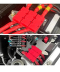 Heavy Duty Badass Six Way Midi Fuse Block And One In Six Out Power Distribution Module Two Hundred Amps shown installed in automotive setting.