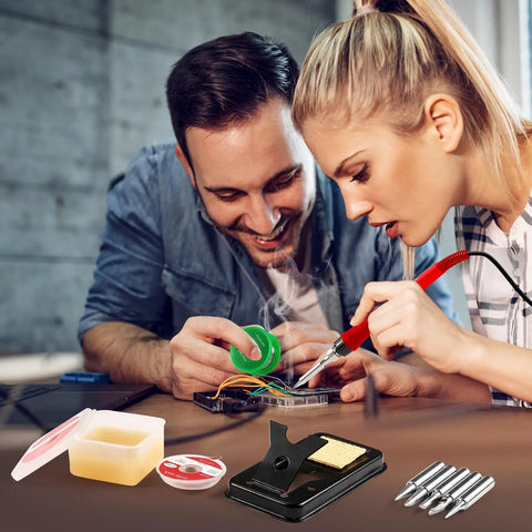 Pro Grade 100W Digital Soldering Iron Kit With Ceramic Heater And LED Display in use, showing iron with accessories like tips and flux.
