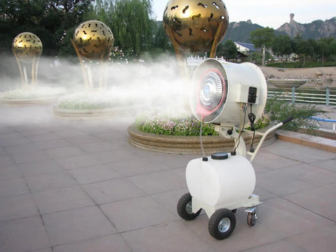 Beat The Heat 20 Inch Portable Misting Fan With Dust Removal For Patios Parks Carnivals And Large Spots features smooth roll cart misting in outdoor setting.