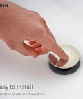 Person pressing the drain of Meena Chrome One-Handle Bathroom Sink Faucet With Single Hole Mount And Optional Deckplate Drain Assembly.