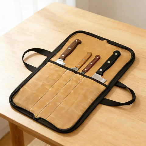 Open canvas knife roll on a table showing four slots with knives, featuring water-repellent material for chefs and outdoor use.
