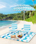 Blue Four Piece Beach Set With Sun Proof Umbrella Two Folding Chairs Waterproof Blanket Portable Beach Kit on sandy shore