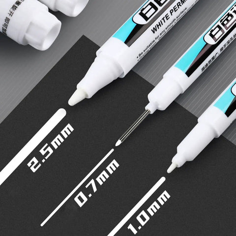 Top Shelf Four Pack Bold White Oil Based Permanent Markers Featuring Slick Quick Dry Ink and Razor Fine Nibs on a black surface.