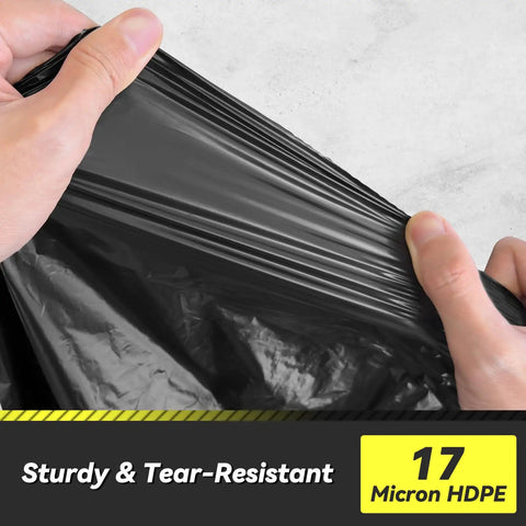 Hands stretching 100 Count 55 To 60 Gallon Black Trash Bags Heavy Duty Tear Resistant And Extra Sturdy Commercial Can Liners