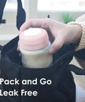 Person placing baby bottle with pink travel cap in bag, showing Travel Caps With Rewritable Sealing Disc For Avent Wide Mouth Bottles Leak Resistant Screw Lids Replacements 6 Pack Pink Compatible With Philips Avent Classic And Spectra Wide Mouth Bottles