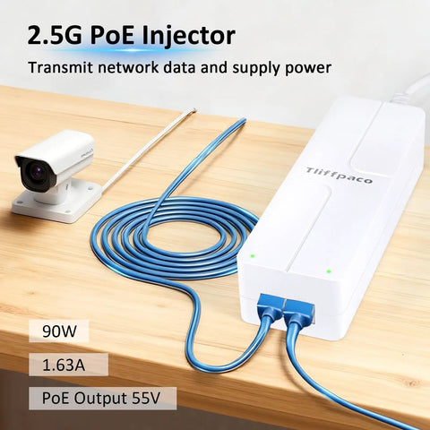 Get Your Network Ready With This 90W PoE Plus Injector connecting to a camera and blue cable on a wooden table.
