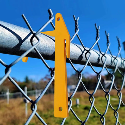 Chain Link Banana Clip Tool Pack For Fence Installation, Top Rail Clamp And Mesh Tensioner hanging on chain-link fence