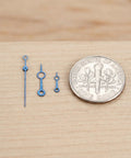 Metal Watch Hands Set for NH35 364R and 7S Movements, against a dime, showcasing size and pro-grade blue finish.
