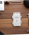 Ultimate Outdoor Waterproof Electrical Junction Box For Surveillance And Electronic Gear Durable Plastic Enclosure on a wooden table.