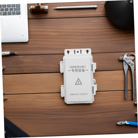 Ultimate Outdoor Waterproof Electrical Junction Box For Surveillance And Electronic Gear Durable Plastic Enclosure on a wooden table.