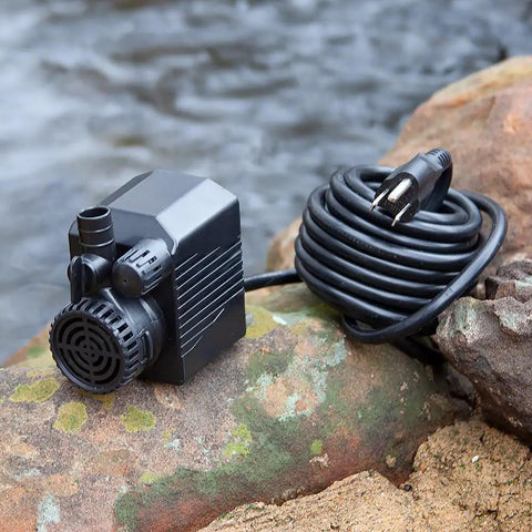 430 GPH Pond Pump 120V Submersible Fountain Pump With Auto Low Water Shut Off 31W shown with coiled 16 ft cord outdoors.