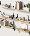 Solid Natural Paulownia Wood Floating Shelves Set Of Six, wall mounted rack displaying books, decor, and plants in stylish arrangement.