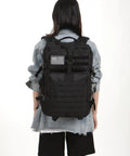 Person wearing All Day Ready 45L Nylon Waterproof Tactical Backpack For Fishing, Hunting, Hiking, Camping And Outdoor Adventures.