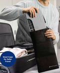 Person packing Porta Traveler Foldable Toilet Stool For Travel 7 Inch Height Gray Portable Discreet Carry On Accessory into suitcase